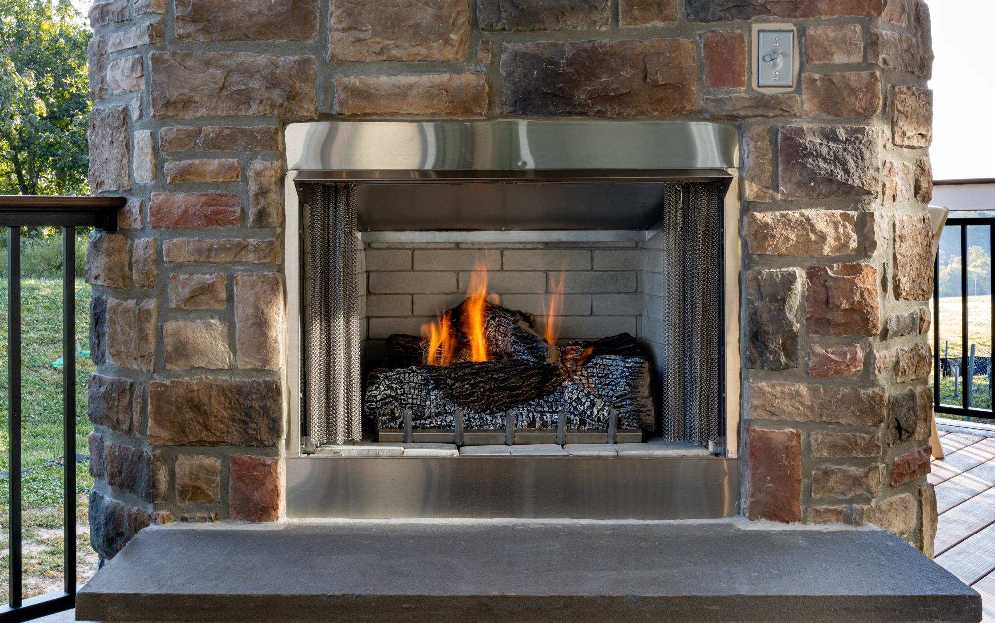 Composite deck with fireplace