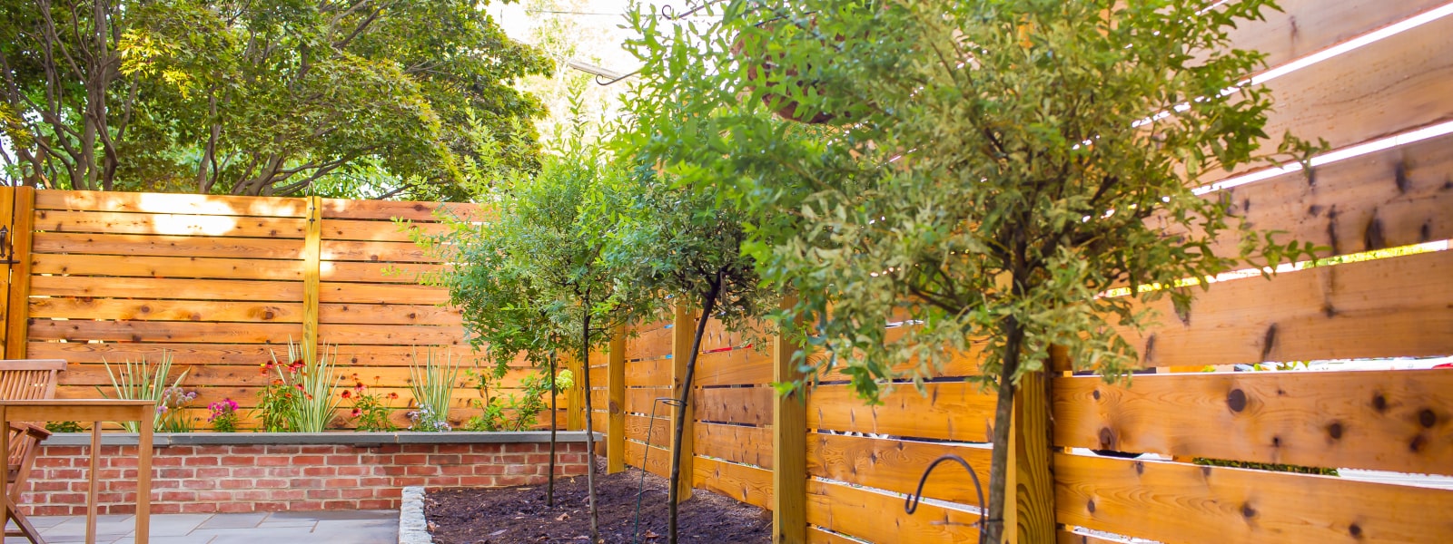 Custom residential wood fence built and installed at home by Devon fence company Integrous
