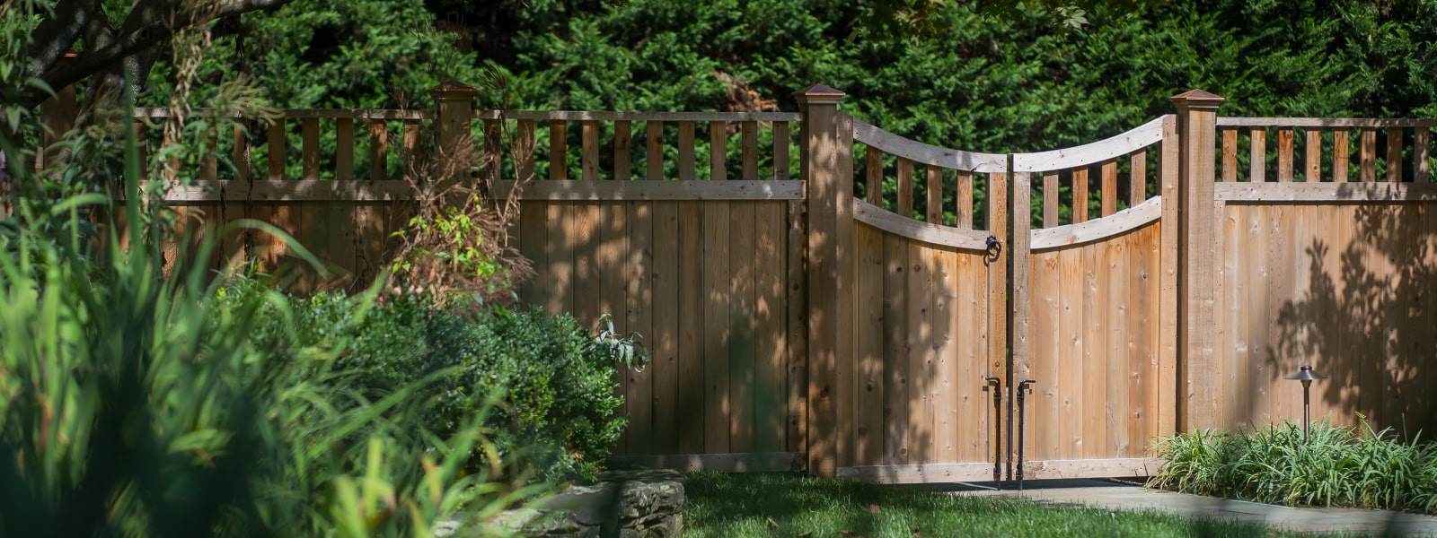 Custom residential wood fence built and installed at home by Wayne fence company Integrous