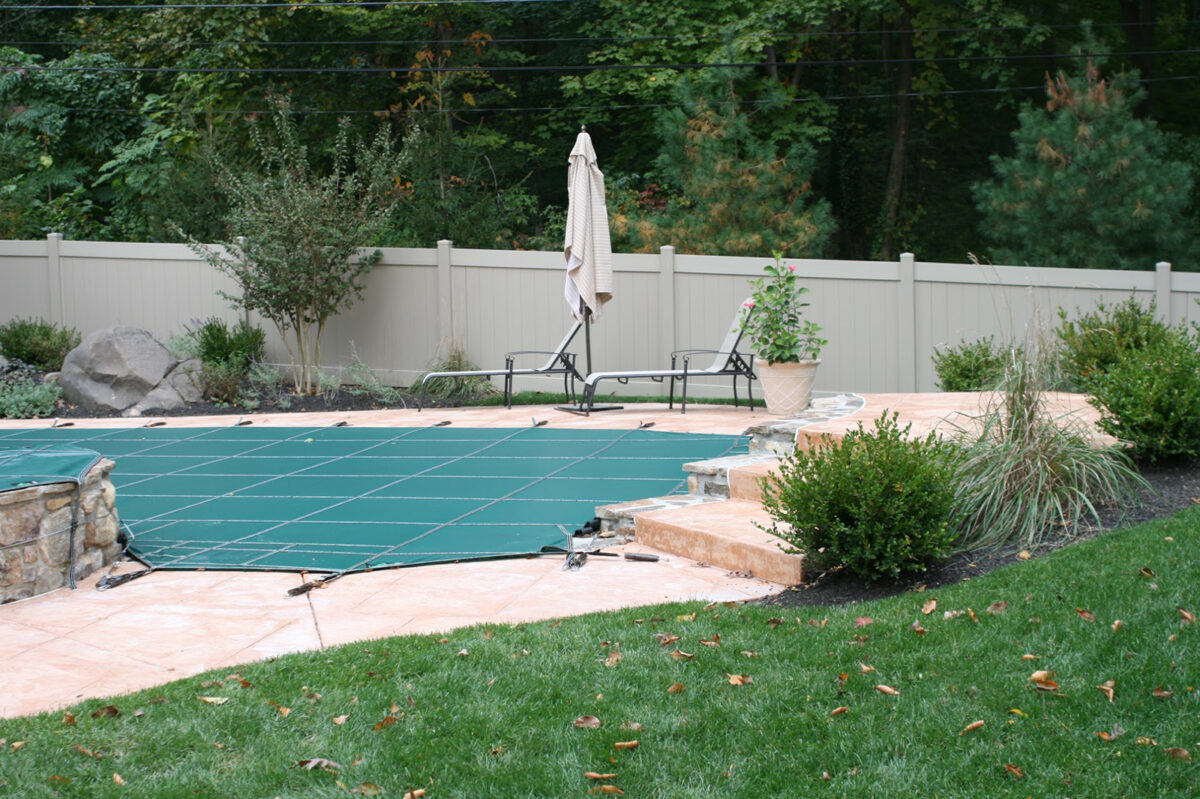 khaki colored vinyl privacy fence around swimming pool