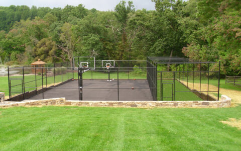 Chain link fence around sports court at a residence