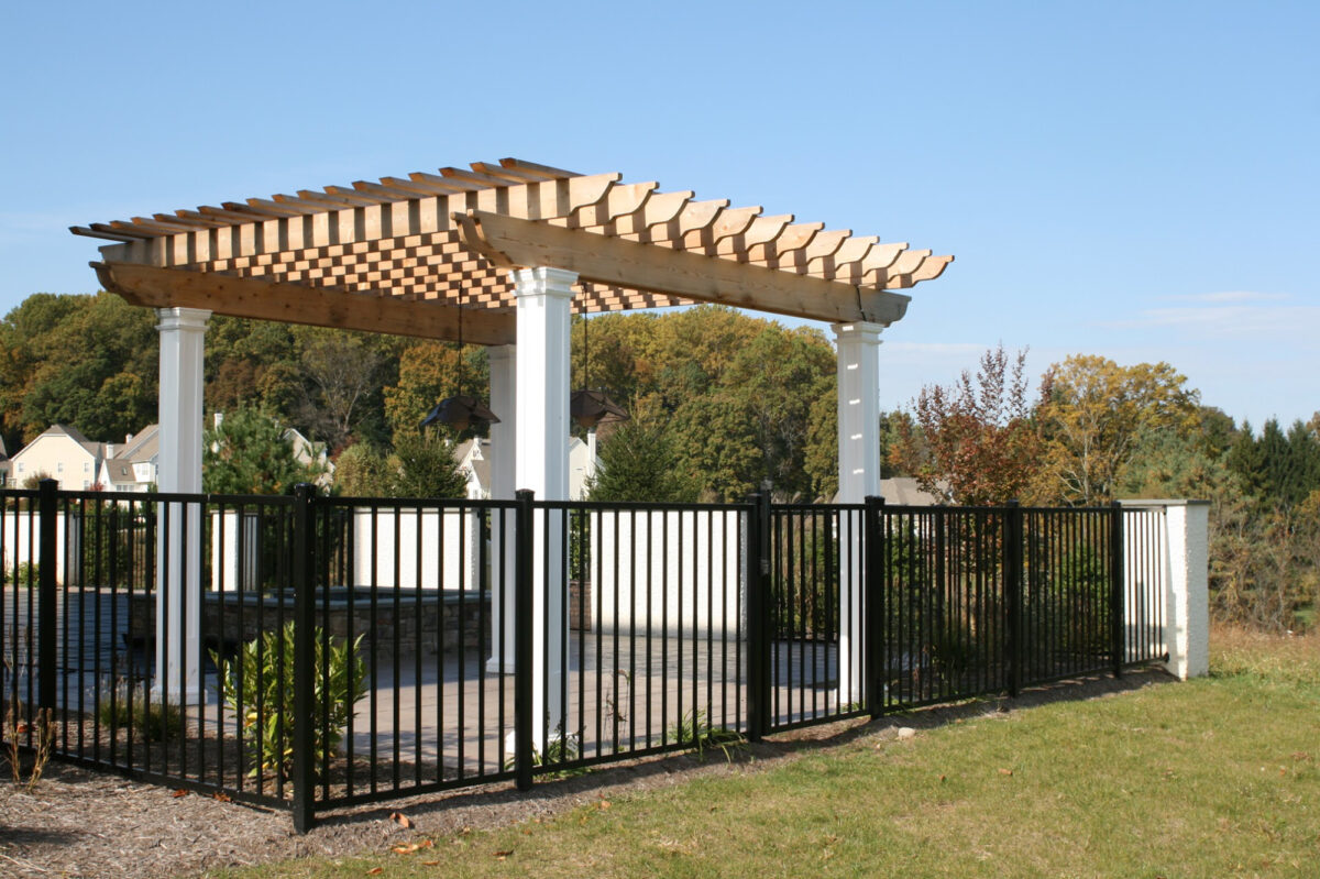 black ornamental metal fence around swimming pool