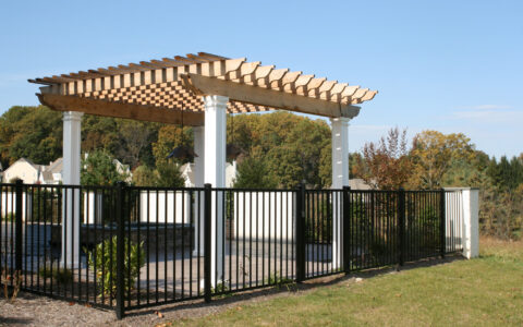 black ornamental metal fence around swimming pool