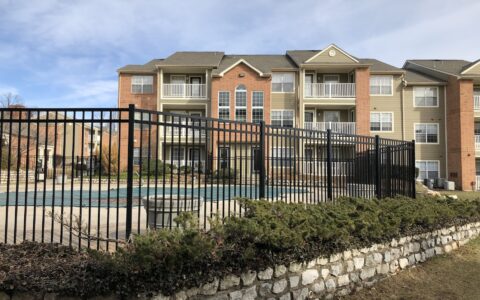 black commercial fence around pool