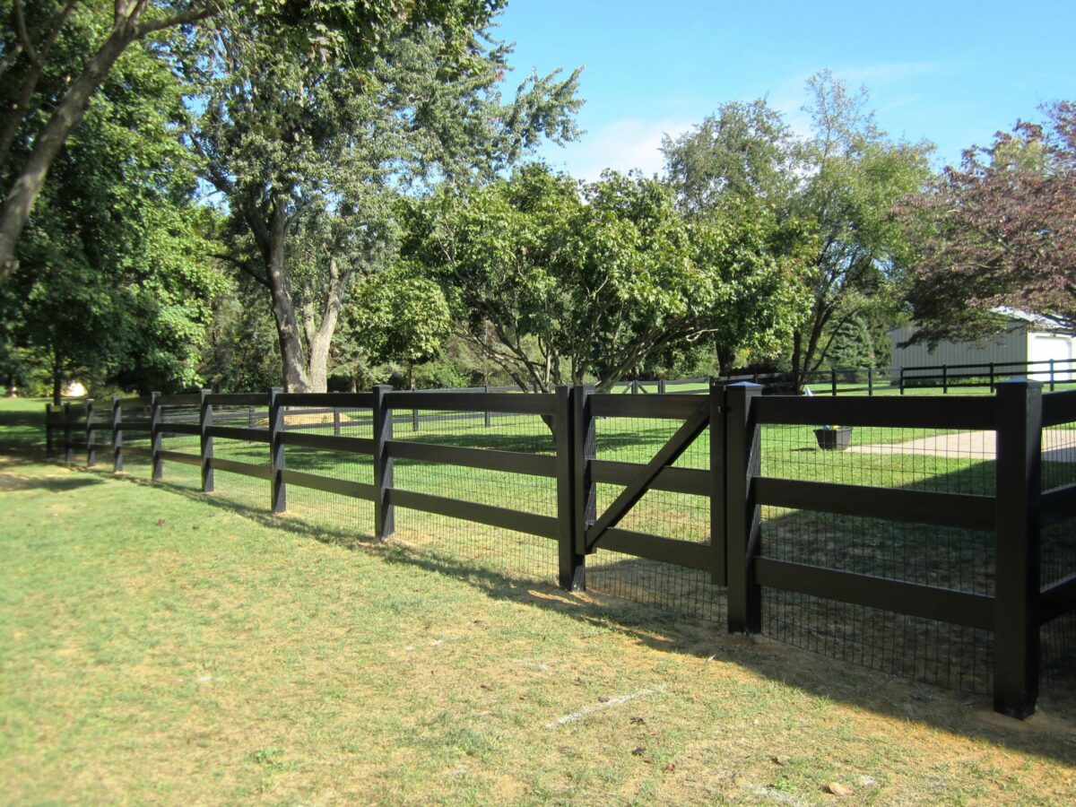 black vinyl rail fence with gate