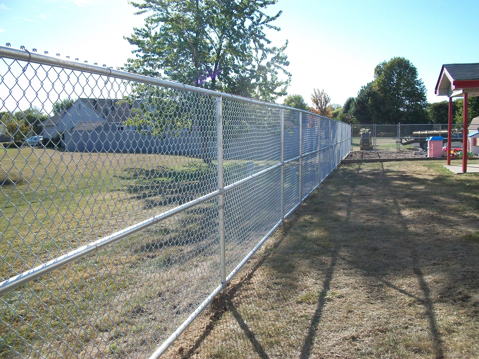 Chain link fence with 3 rails