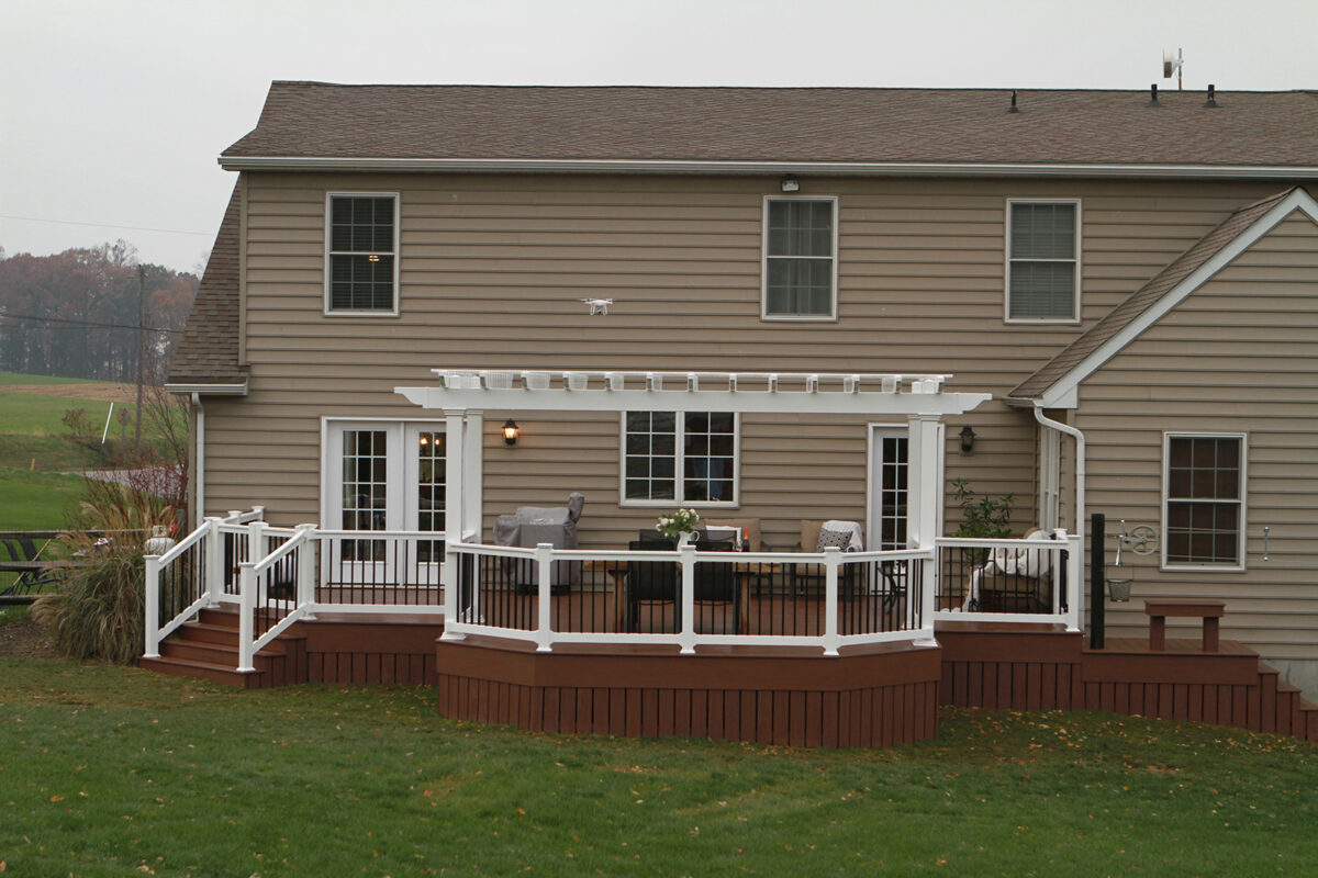 deck with pergola and railing