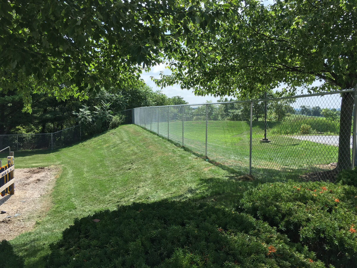 Chain link fence with top rail