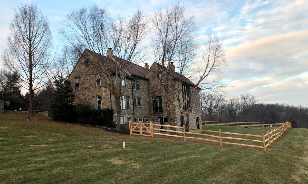 split rail fence with wire mesh in yard