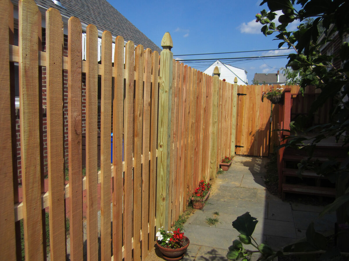 Shadowbox fence with french gothic posts