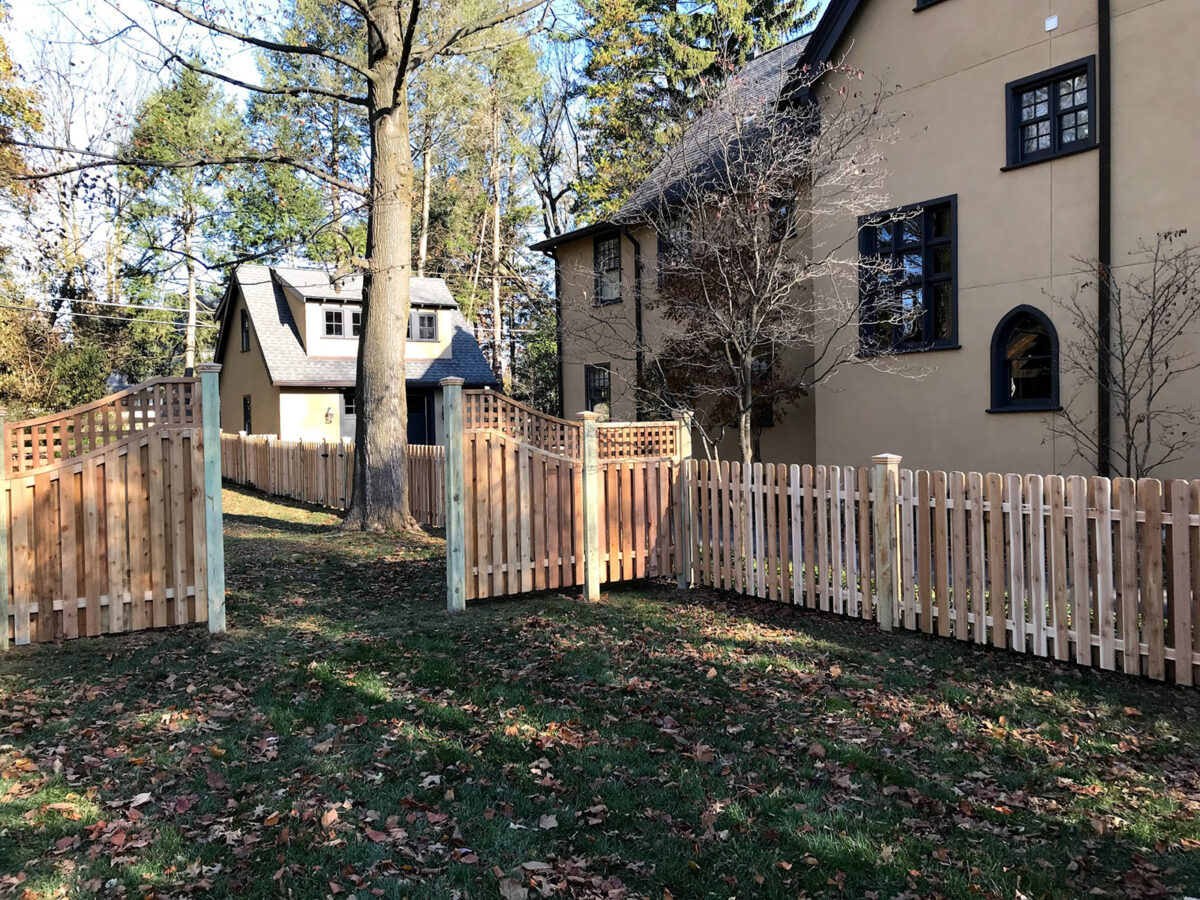 Shadowbox fence with lattice top and arched sections