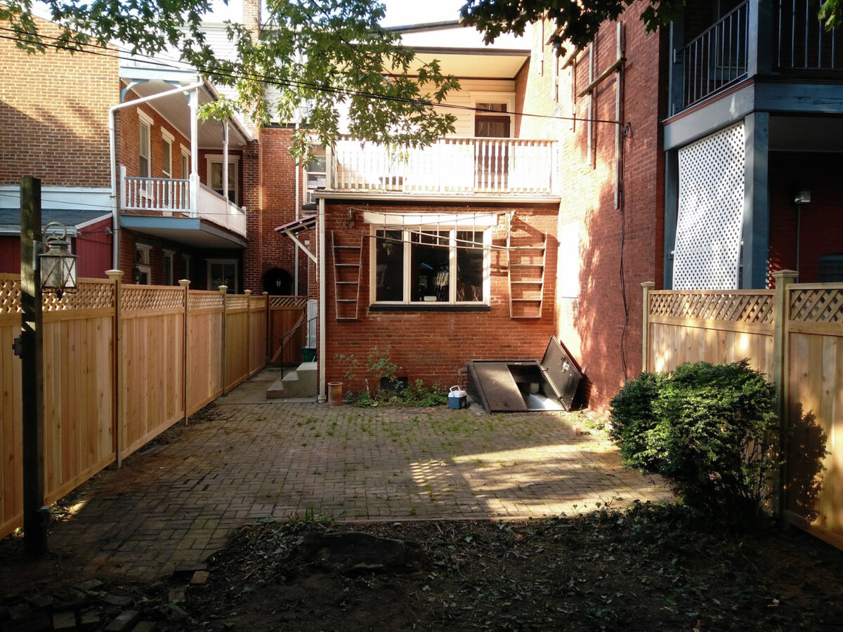 decorative wooden privacy fence in back yard