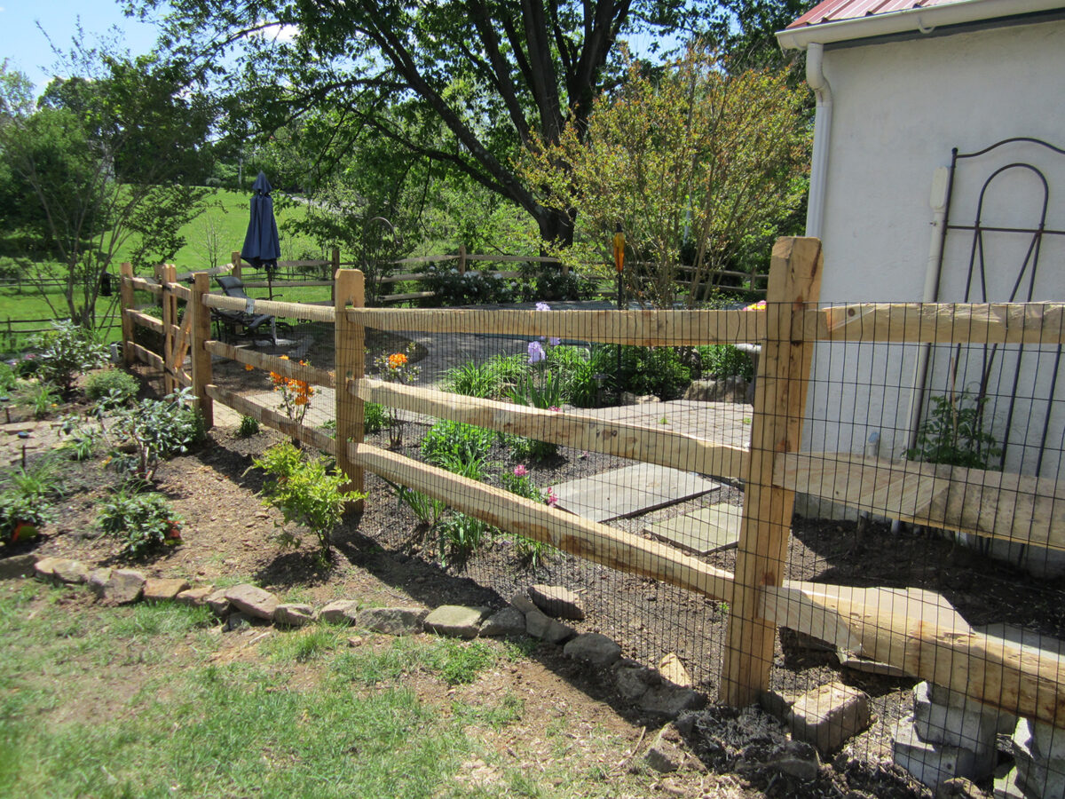 Split rail fence around pool