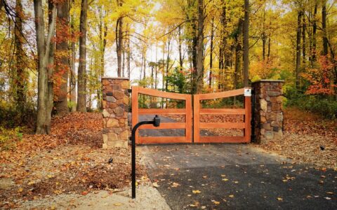 wood rail driveway gate with automated opener