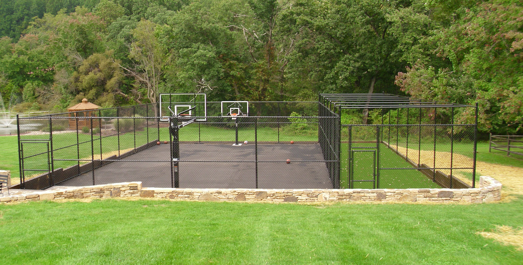 10' tall black chain link sports enclosure