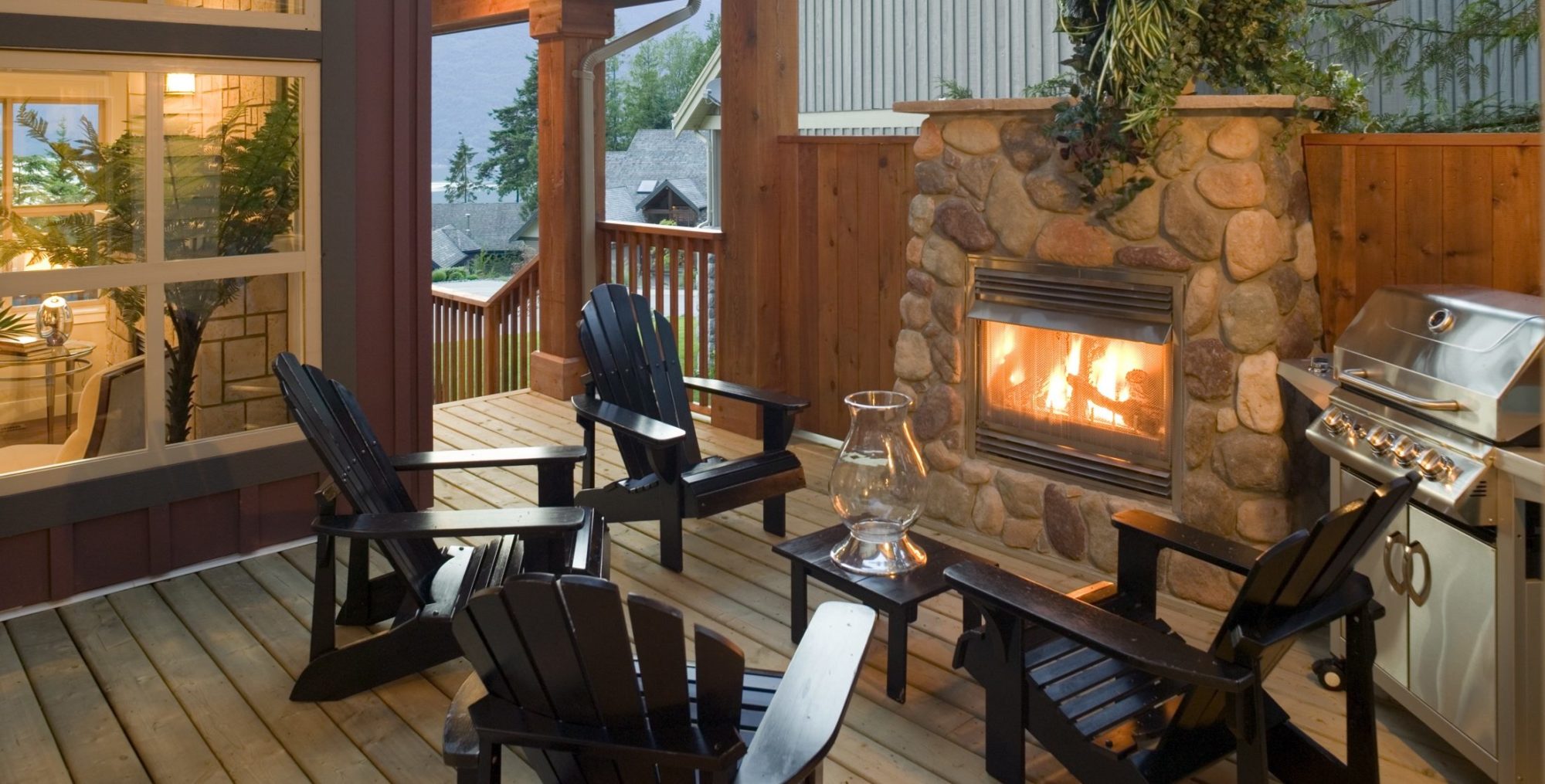 Outdoor seating area with fireplace and grill