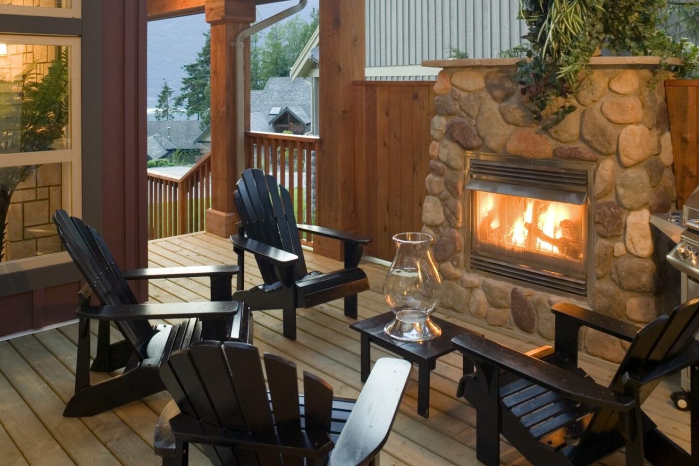 Outdoor seating area with fireplace and grill