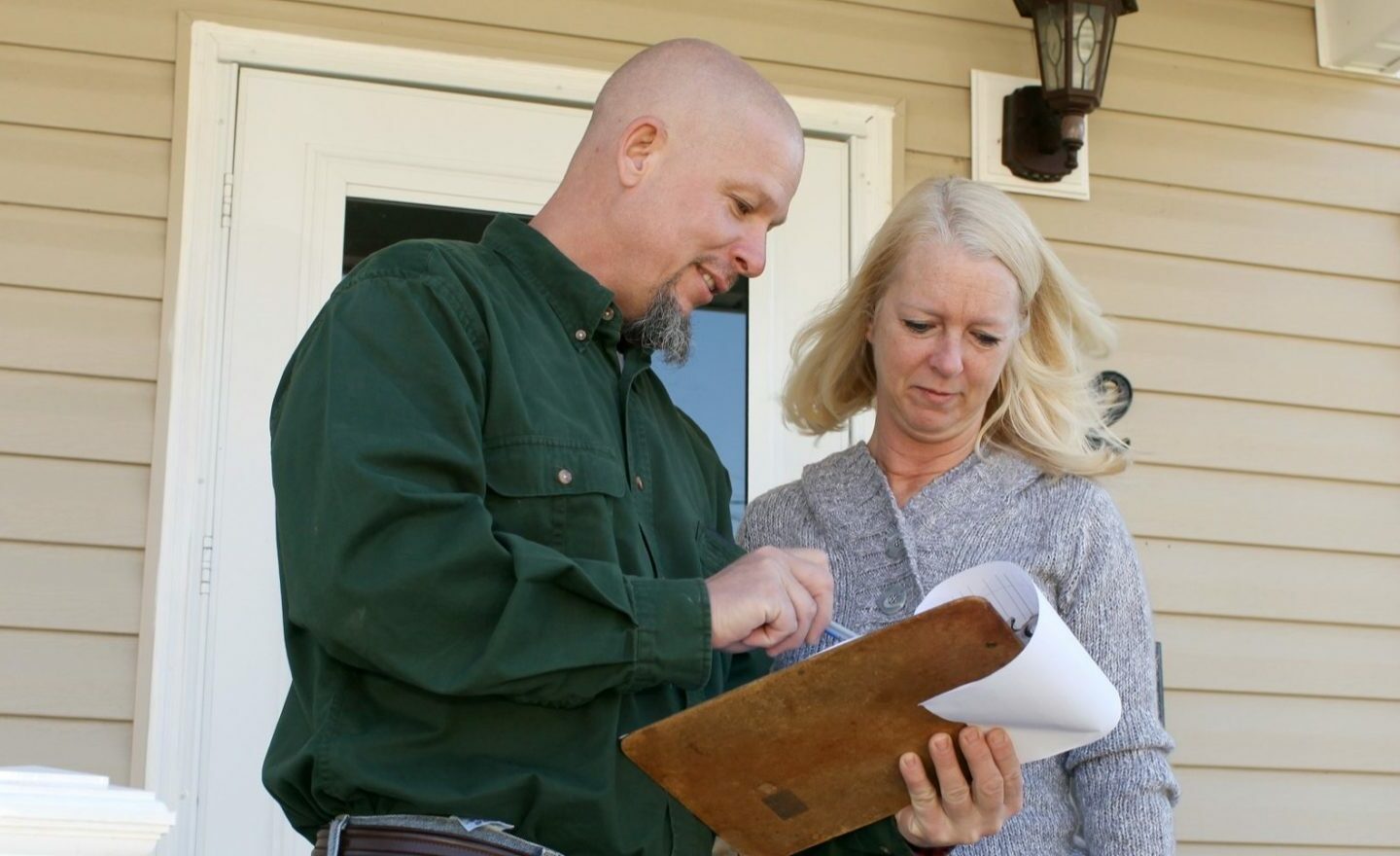 Contractor going over details of home inspection.