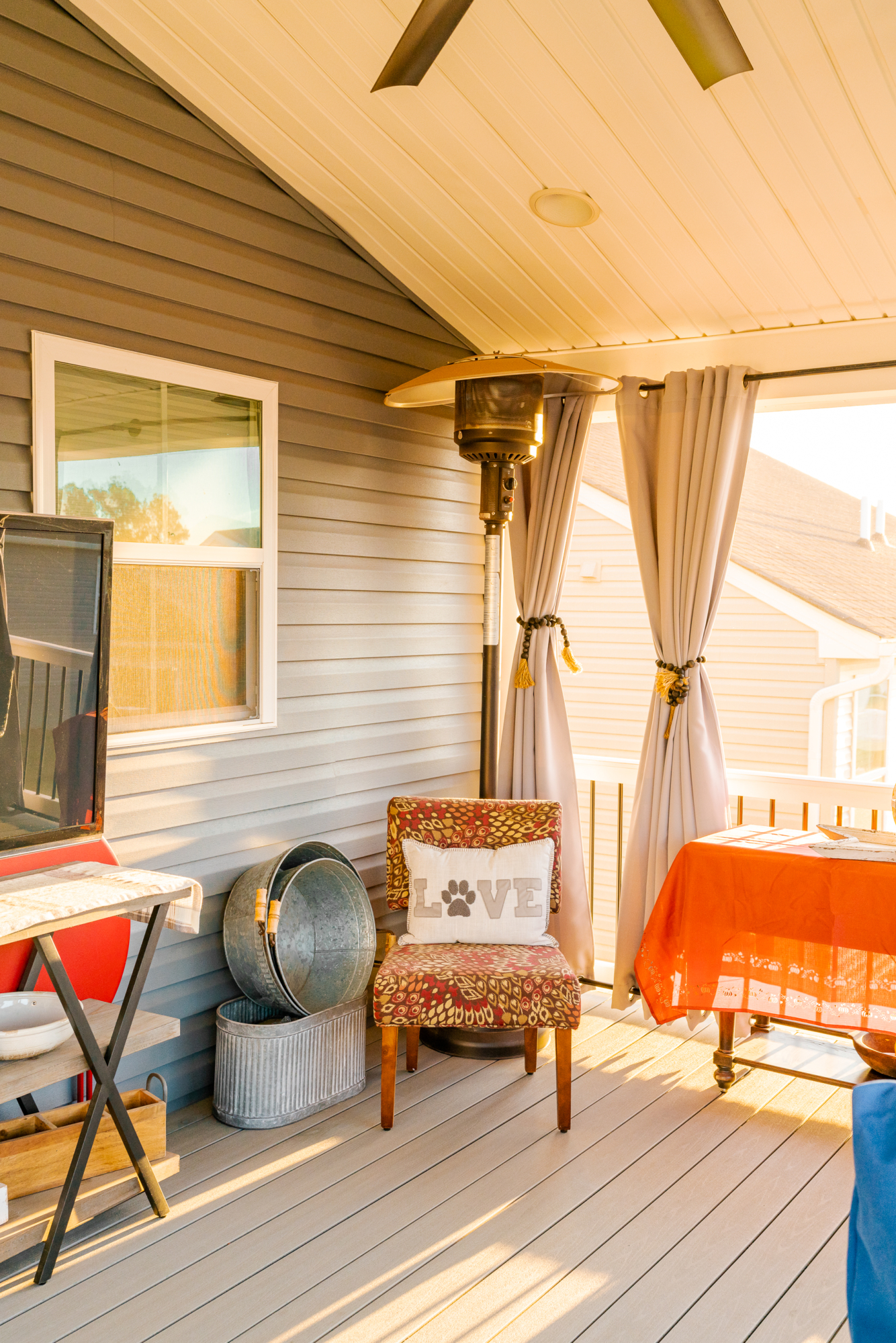 image of a deck with a screened in roof in coatesville pa built by integrous fences and decks featuring a screened in roof area an open deck timbertech decking white vinyl railing with black aluminum balusters and one set of stairs to grade
