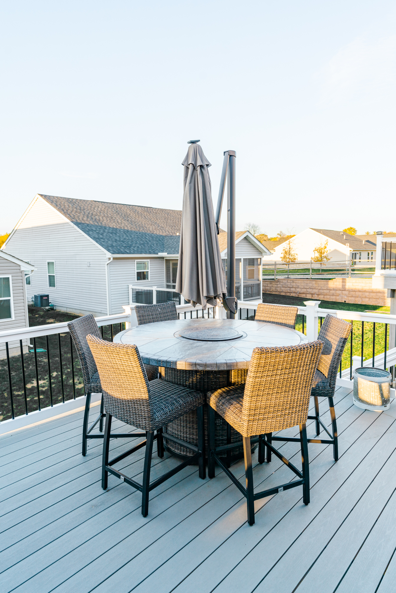 image of a deck with a screened in roof in coatesville pa built by integrous fences and decks featuring a screened in roof area an open deck timbertech decking white vinyl railing with black aluminum balusters and one set of stairs to grade