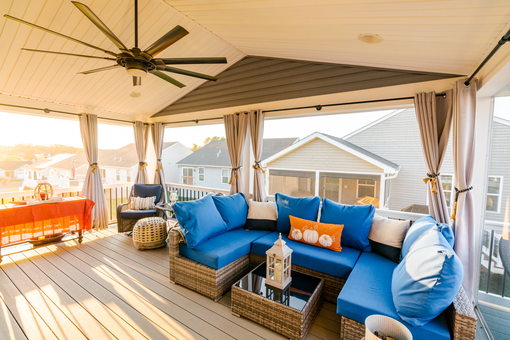 image of a deck with a screened in roof in coatesville pa built by integrous fences and decks featuring a screened in roof area an open deck timbertech decking white vinyl railing with black aluminum balusters and one set of stairs to grade