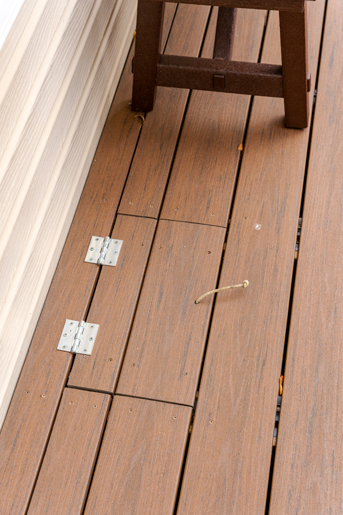image of a deck with lattice skirting in media pa built by integrous fences and decks featuring timbertech decking white vinyl railing, and white vinyl underdeck lattice skirting with two steps to grade