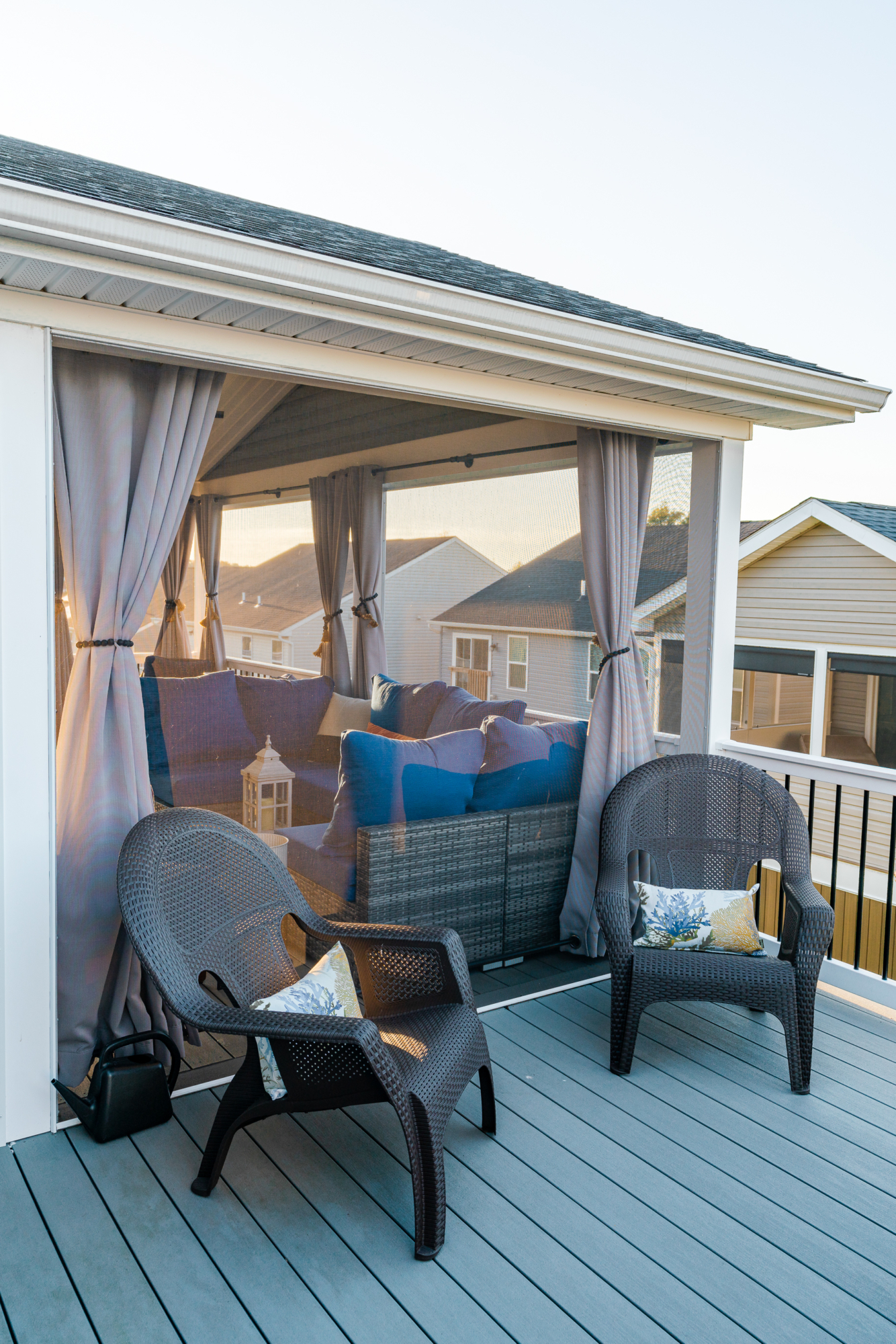 image of a deck with a screened in roof in coatesville pa built by integrous fences and decks featuring a screened in roof area an open deck timbertech decking white vinyl railing with black aluminum balusters and one set of stairs to grade
