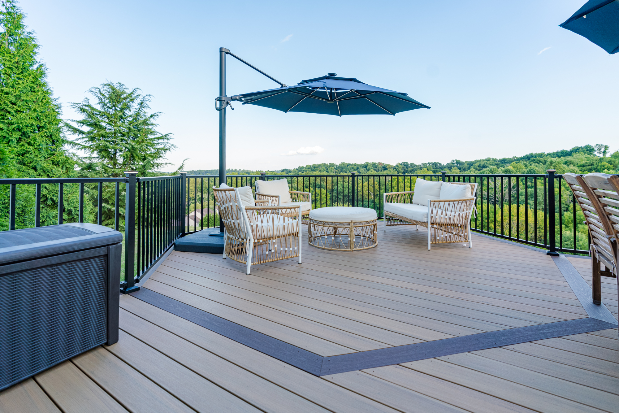 image of an octagon deck in douglassville pa built by integrous fences and decks featuring timbertech decking and black aluminum railing