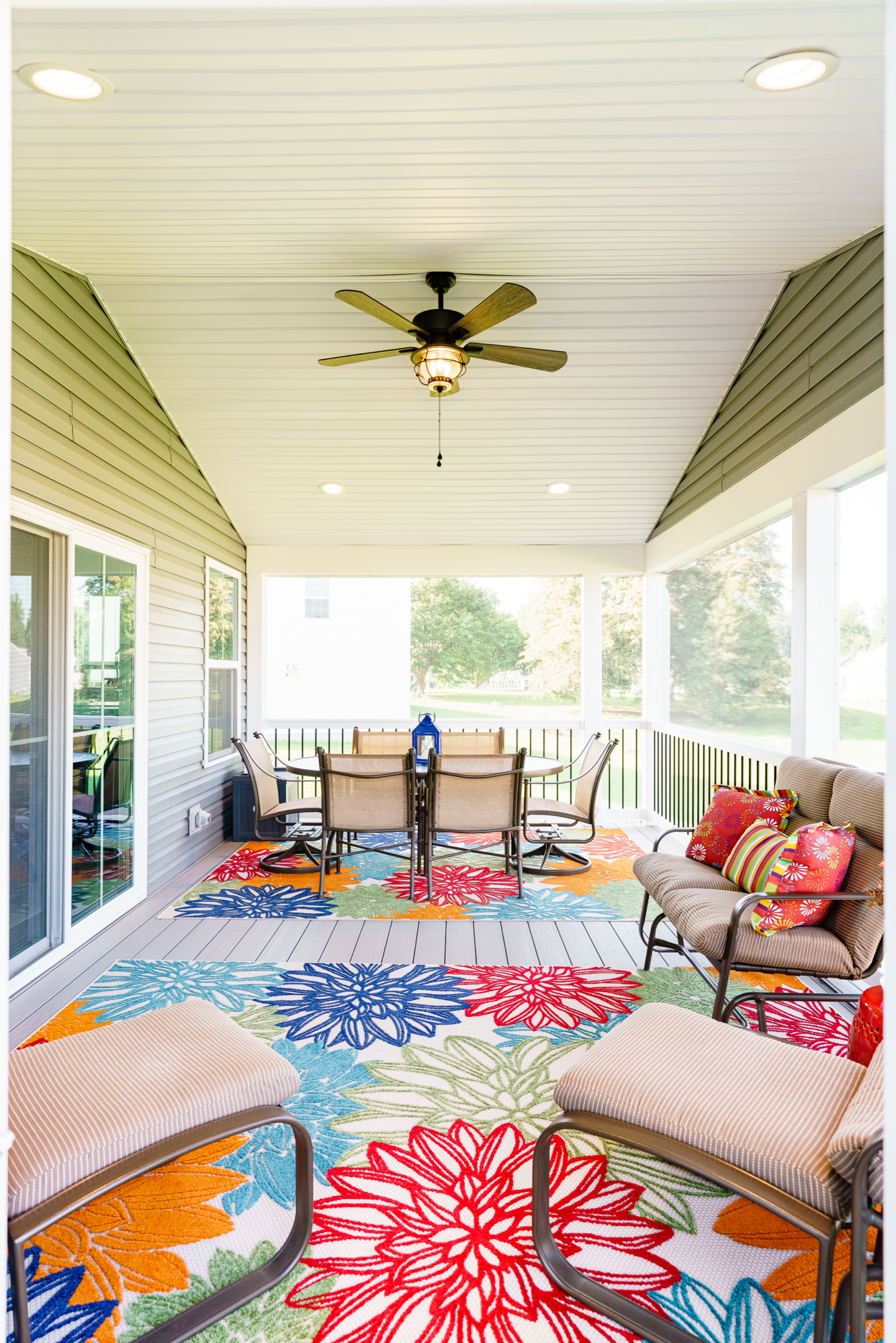 image of a screened in roof area with recessed lights and a ceiling fan built by integrous fences and decks
